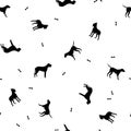 The seamless pattern with black silhouettes of different dogs on a white background. Vector. Royalty Free Stock Photo